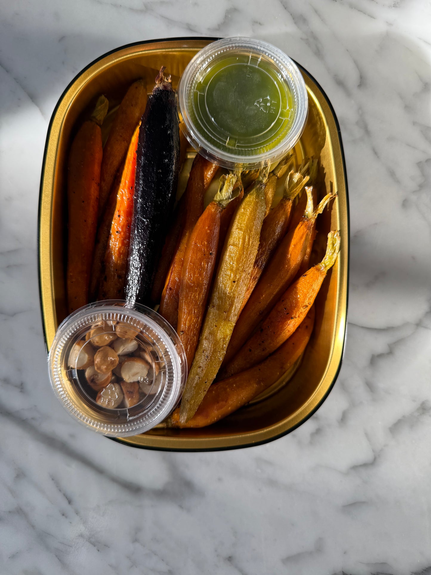 Roasted Rainbow Carrots with Toasted Hazelnuts and Spicy Zhoug sauce.